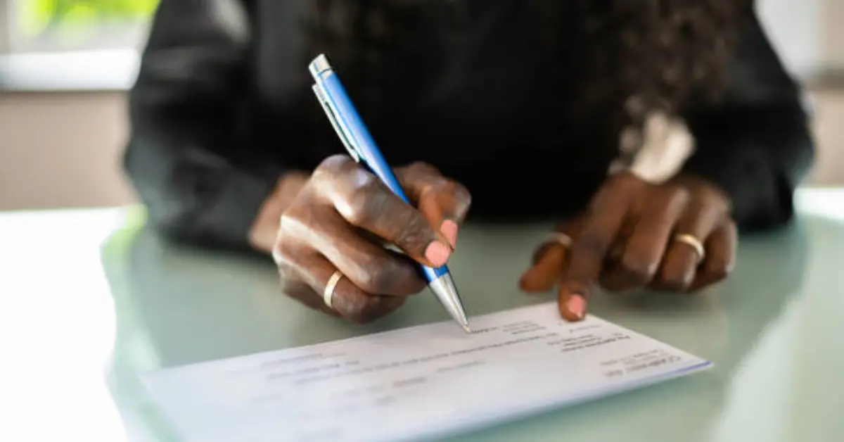 Step-by-step guide to writing a check, showing the process from filling out the date to signing the check